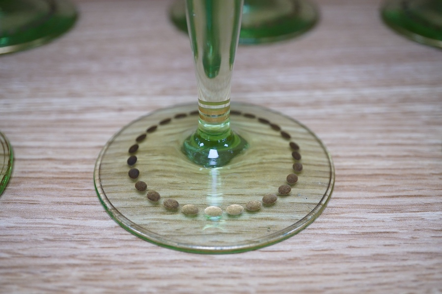 A set of six Bohemian wine glasses with ornate gilt decorated bowls, height 19cm. Condition - good